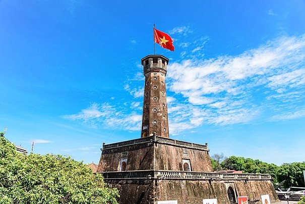 pngtree-under-a-blue-sky-with-clouds-the-vietnamese-flag-flies-proudly-on-the-hanoi-flag-tower-in-a-closeup-shot-photo-image_28524404.jpg